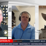 Sheriff Mack, Sam Bushman, talk with Sheriff Jesse Watts.