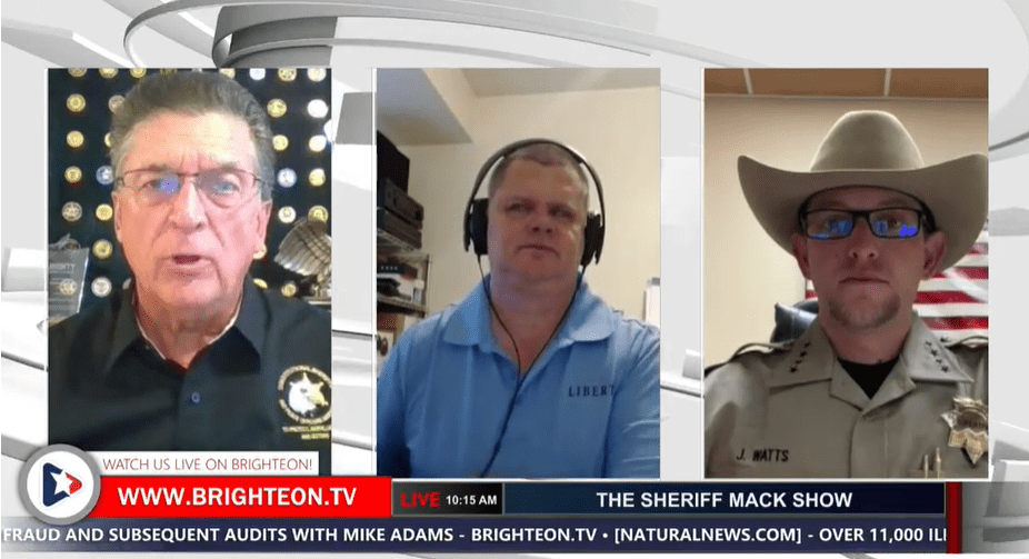 Sheriff Mack, Sam Bushman, talk with Sheriff Jesse Watts.