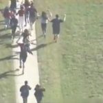 Students run to safety as police search for suspect.