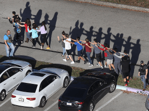 Students are escorted off campus during a school shooting.